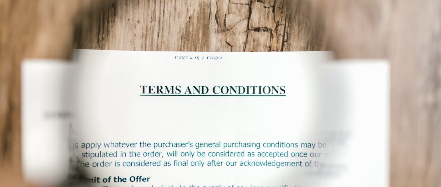 selective focus photo of terms and conditions written on a paper