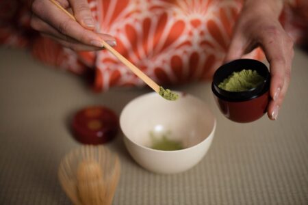 woman wearing traditional geisha kimono at tea ceremony